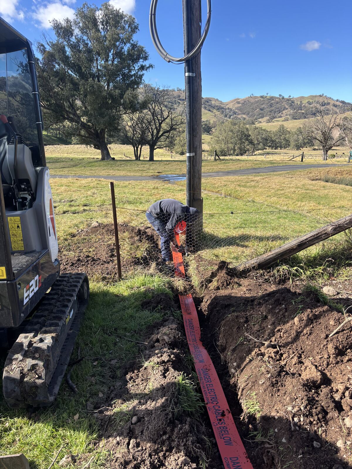 Calwinn Electrical technician working on an underground electrical cable run in the Upper Hunter Shire